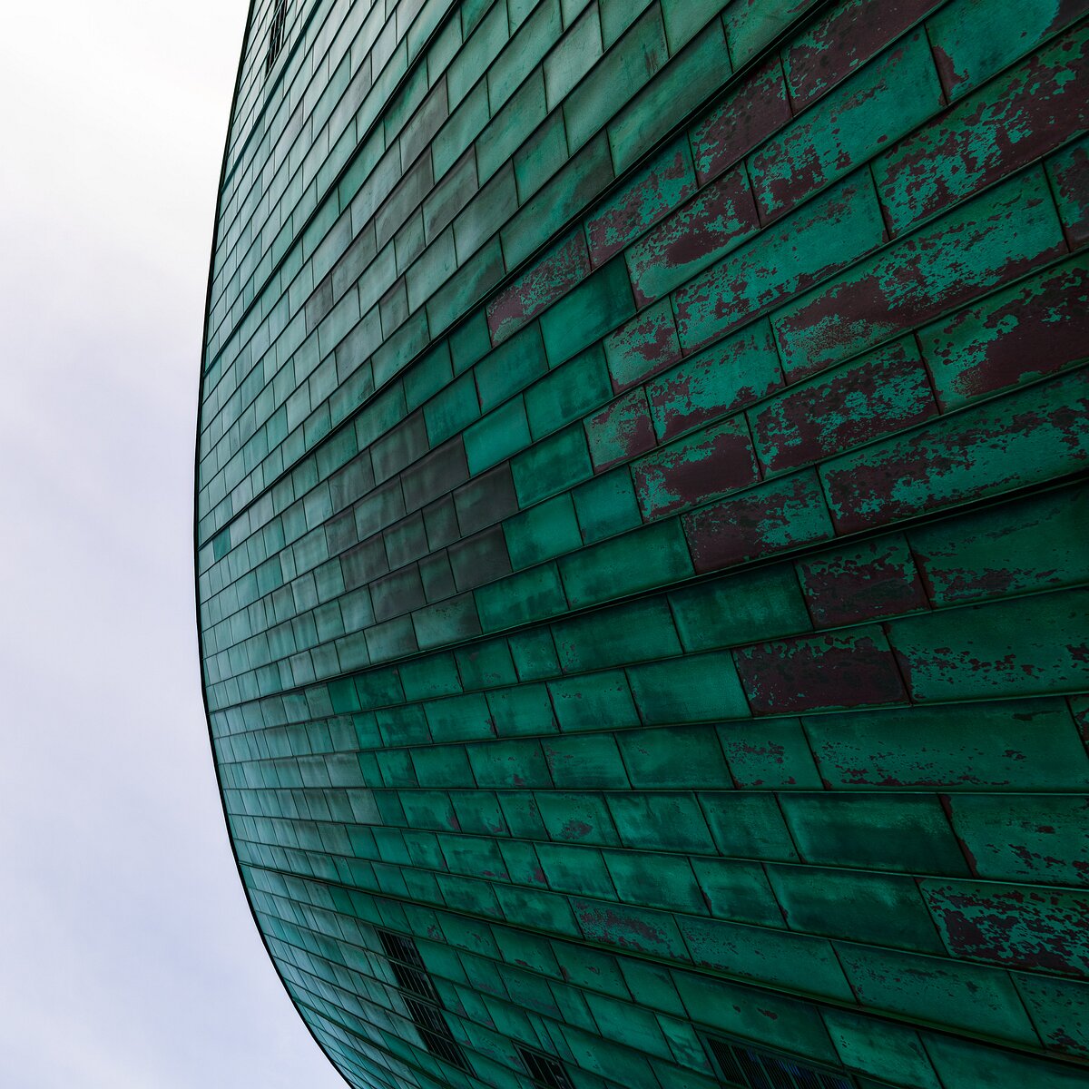 Curved Copper Close-up of the curved copper exterior of the NEMO Science Museum in Amsterdam.