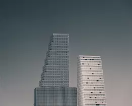 Stepped Towers Three stepped high-rise buildings rise against a muted grey sky.