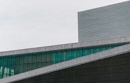 Glass Ribbon Sloping marble roofline and green-tinted glass of the Oslo Opera House.