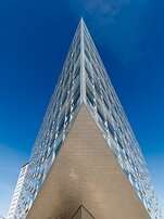 Sharp Geometry Sharp glass wedge of Krystallen office building pointing skyward in Copenhagen.