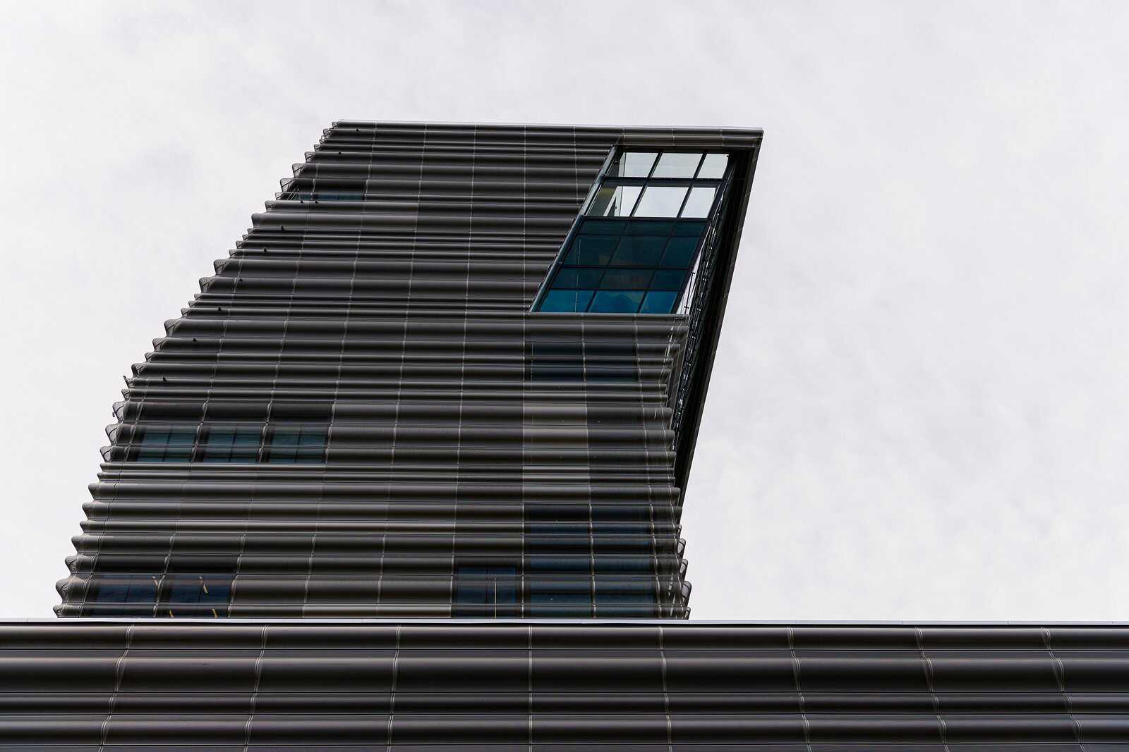 Modern Monolith Tilted ribbed-glass tower of the MUNCH Museum rising over Oslo.