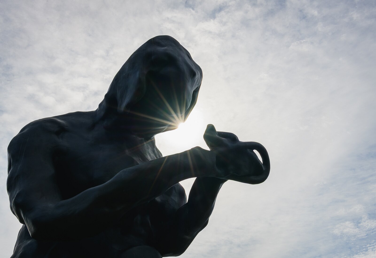Quiet Contemplation Back-lit bronze sculpture "The Mother" by Tracey Emin kneeling outside the MUNCH Museum in Oslo.