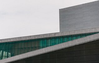 Glass Ribbon Sloping marble roofline and green-tinted glass of the Oslo Opera House.
